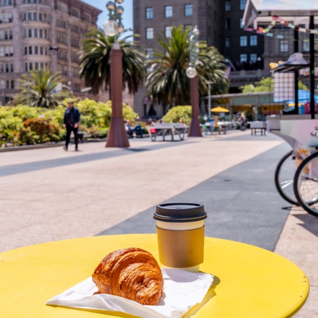 croissant and coffee on a table in union square in san fransisco