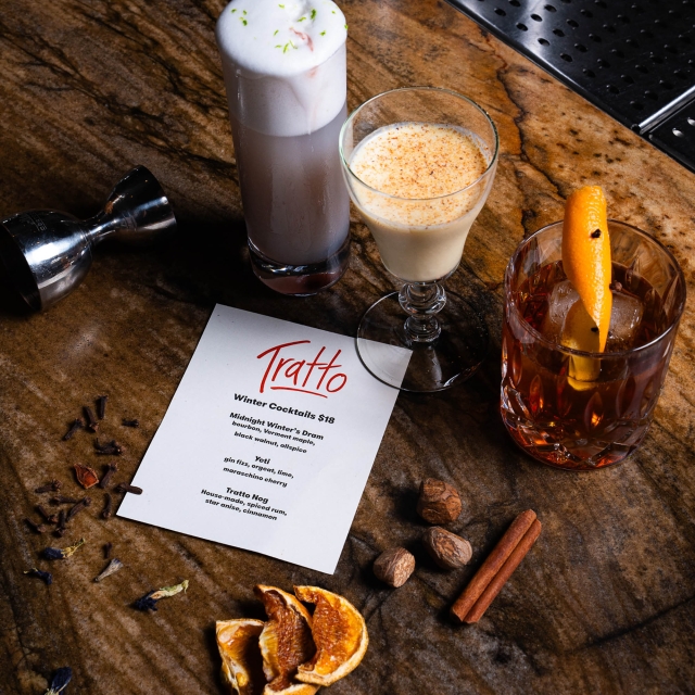 Close up of drinks and a menu for Tratto at The Marker