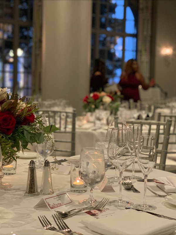 Close up of a table set up for a wedding at The Marker with people in the background