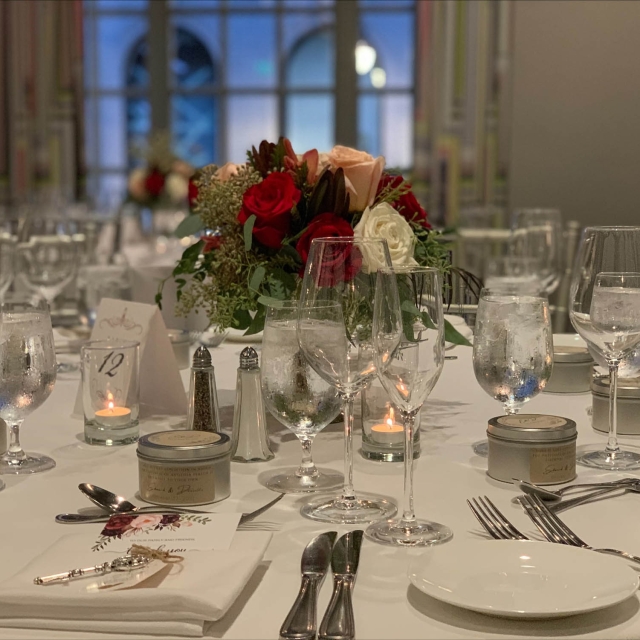 Close up of glass wear and cutlery sitting on a table