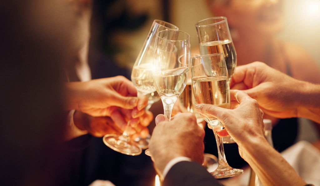 A close up of people enjoying drinks