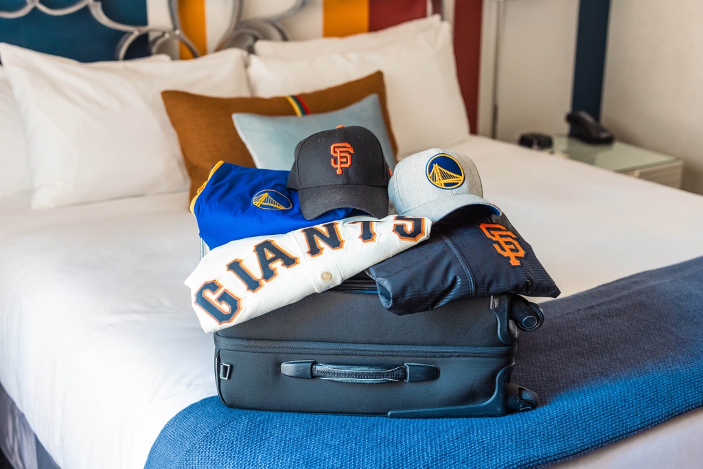 San Francisco sports teams merchandise sitting on luggage at The Marker