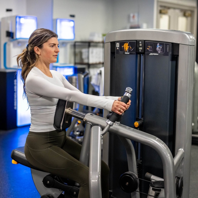 A woman working out at the gym inside The Marker