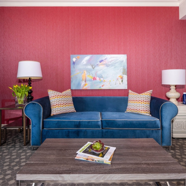 A blue couch in a living room at The Marker