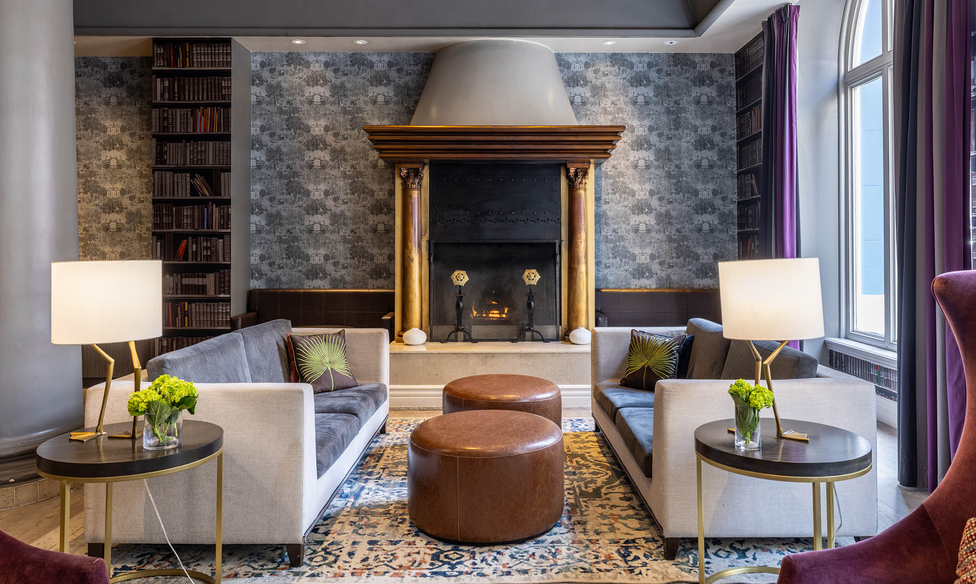 Close up of a seating area in front of a large fire place at The Marker