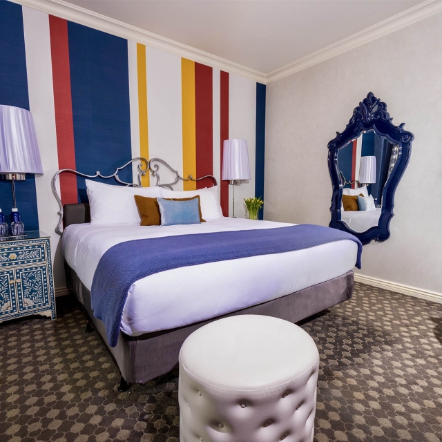 Side view of a large bed in a bedroom at The Marker